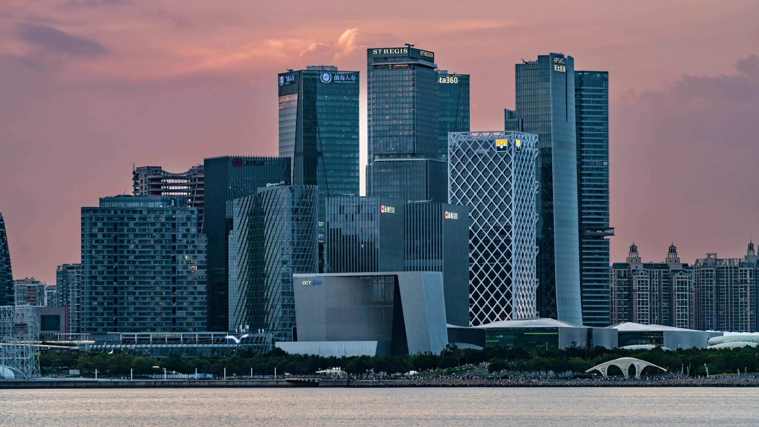 Captivating view of a modern city skyline with high-rise buildings at sunset.